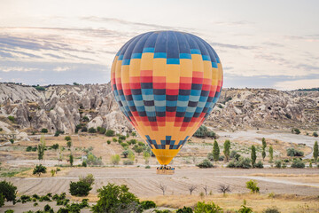 Colorful hot air balloon flying over Cappadocia, Turkey