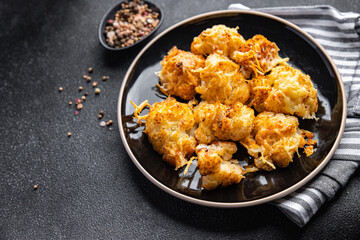 cauliflower baked cheese vegetable meal food snack on the table copy space food background rustic top view keto or paleo diet veggie vegan or vegetarian food