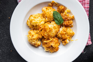 cauliflower baked cheese vegetable meal food snack on the table copy space food background rustic top view keto or paleo diet veggie vegan or vegetarian food