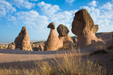 Bizarre volcanic rock formations of Imagination or Devrent Valley in Cappadocia under blue sky with...