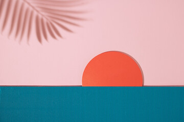 Sunset beach landscape scene made with ribbed paper, wooden circle and palm leaf shadow.