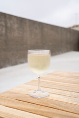 glass of green wine on table