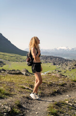 fit woman walking in the mountains