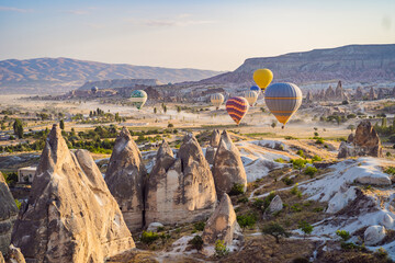 Colorful hot air balloon flying over Cappadocia, Turkey - obrazy, fototapety, plakaty