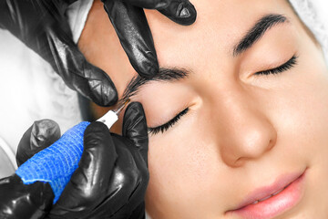 Eyebrows tattoo or Permanent Makeup. - obrazy, fototapety, plakaty