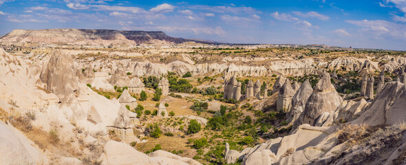 Fototapeta na wymiar Unique geological formations in Love Valley in Cappadocia, popular travel destination in Turkey