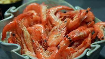 Plate of shrimps. Closeup of many sea food on bowl. Shrimp