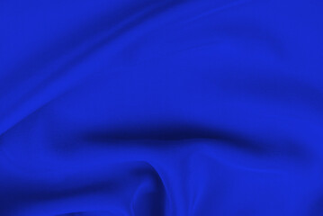 Rich and luxury red silk fabric texture background.