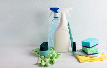Set of cleaning equipment for cleaning various surfaces on light marble background. Concept of...