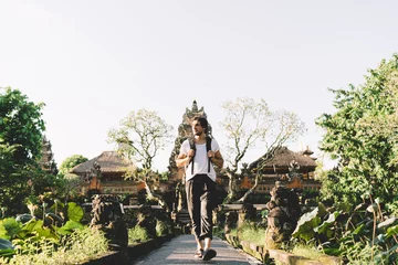 Foto op Aluminium Man exploring oriental Water Palace temple in Bali © BullRun