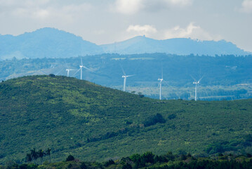Wind farm in rural Guatemala, volcanic and mountainous terrain.