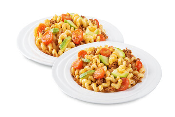 Minced beef zucchini tomatoes pasta in a plate on a white isolated background