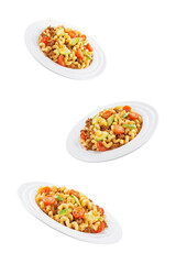 Minced beef zucchini tomatoes pasta in a plate on a white isolated background
