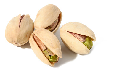 Fried salted pistachios in shell on white isolated background, delicious snack