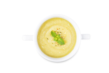 Zucchini soup in a bowl on a white isolated background