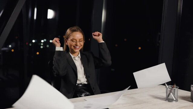 Success, marketing and business woman with paper for trading, investment celebration and happy with proposal. Achievement, smile and corporate employee excited about winning company bonus with report