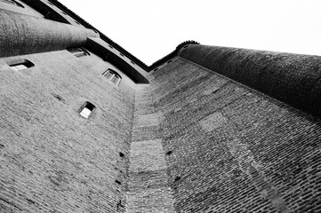 Walls of Bishop palace in medieval town of Albi in Roussillon-Languedoc, France. View from the bottom. Black white historic photo.