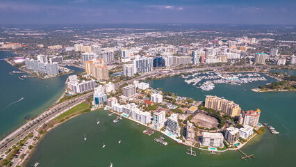 Fototapeta premium Panorama of City Sarasota FL. Beautiful beaches in Florida. Spring or summer vacations in Florida. Beautiful View on Hotels and Resorts on Island. America USA. Gulf of Mexico. Aerial travels photo.