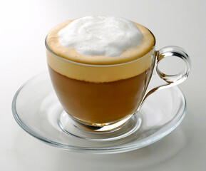 Cappuccino in transparent glass cup