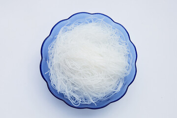 Vermicelli in bowl on white background.