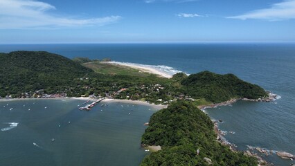 Aerial view of an island in the middle of the sea with boats