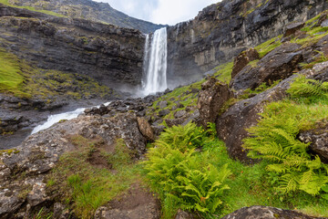 The Fossa Waterfall on island Bordoy. This is the highest waterfall in the Faroe Islands, situated in wild scandinavian scenery. Summer day