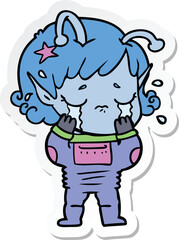 sticker of a cartoon crying alien girl