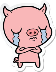 sticker of a cartoon pig crying