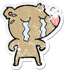 distressed sticker of a cartoon crying bear