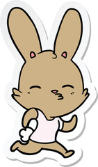 sticker of a cartoon running rabbit