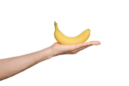 Yellow fresh banana in male hand, isolate