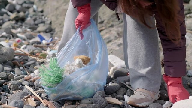 environmental protection concept. young volunteer remove garbage plastic and paper waste bottles trash. ecology pollution problem