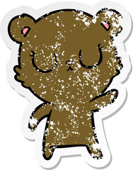 distressed sticker of a peaceful cartoon bear