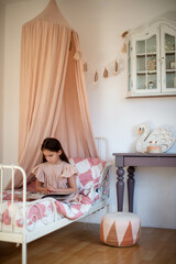 children's room for a little girl with a canopy over a pink bed. scandinavian children's room © Маргарита Медведева