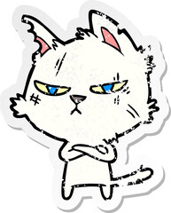 distressed sticker of a tough cartoon cat