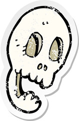 retro distressed sticker of a funny cartoon skull
