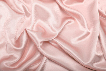 Beige pink pearl wave fabric silk. Abstract texture horizontal copy space background.