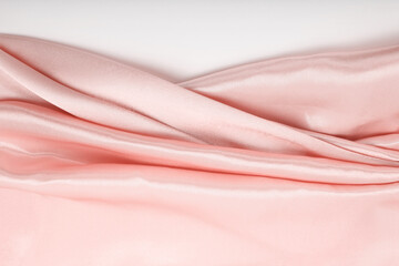 Pink nacre wave fabric silk. Abstract texture horizontal copy space background.