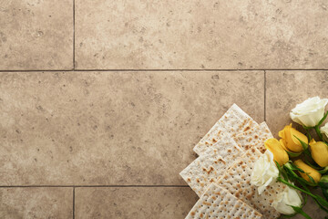 Passover celebration concept. Matzah, kosher red wine, walnut and white and yellow roses....
