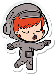 sticker of a cartoon pretty astronaut girl pointing