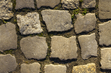 Abstract background of old cobblestone close up.