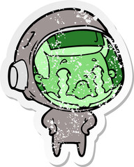distressed sticker of a cartoon crying astronaut