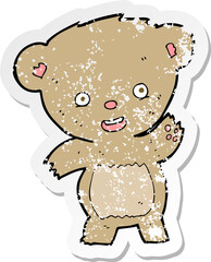 retro distressed sticker of a cartoon waving teddy bear
