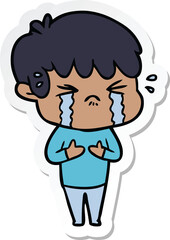 sticker of a cartoon boy crying