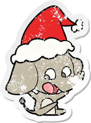 cute distressed sticker cartoon of a elephant wearing santa hat