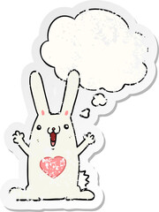cartoon rabbit in love and thought bubble as a distressed worn sticker