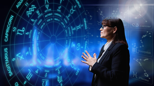 Woman interested in astrology, universe stars astrological wheel background