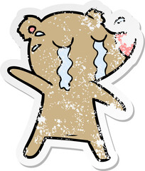 distressed sticker of a cartoon crying bear