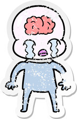 distressed sticker of a cartoon big brain alien crying