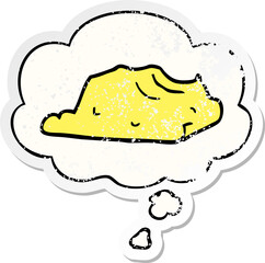 cartoon butter and thought bubble as a distressed worn sticker